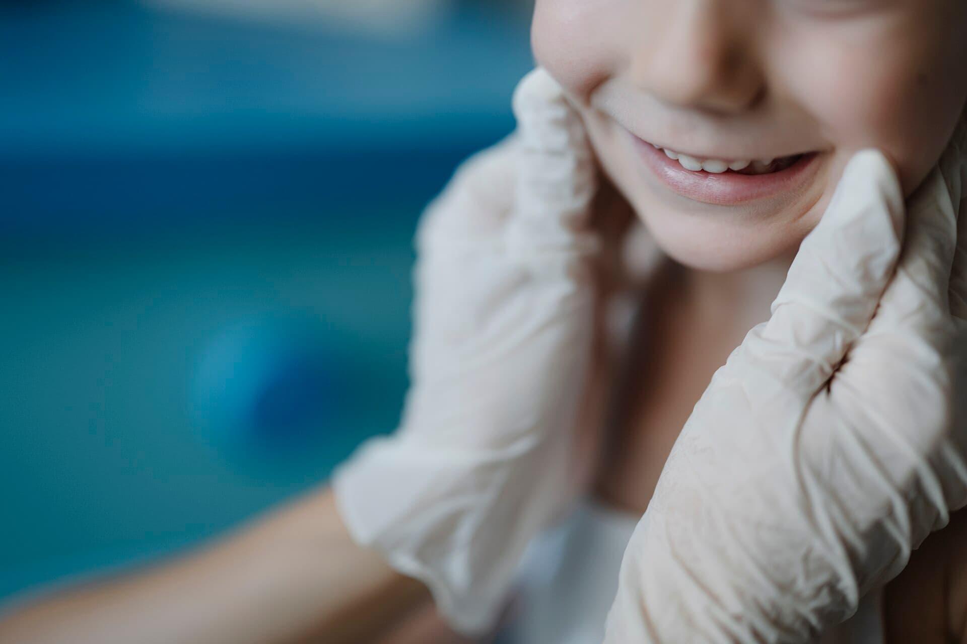 A child receiving a dental check-up in a clinic
